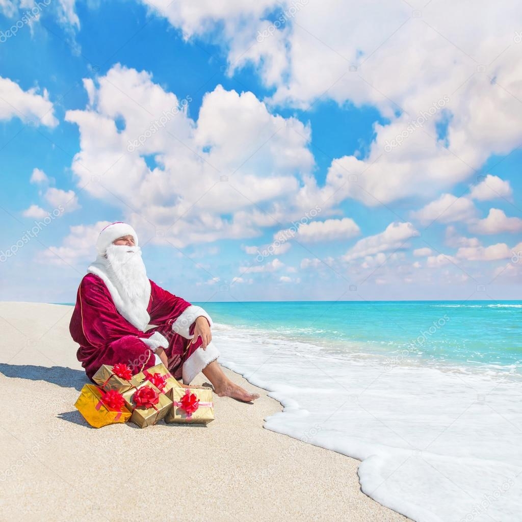 Santa Claus Relaxing On Tropical Beach Stock Photo EM prize 60080373